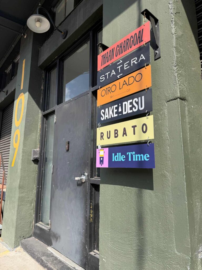 Idle Time wine lounge 109 SE Salmon green front door with signage